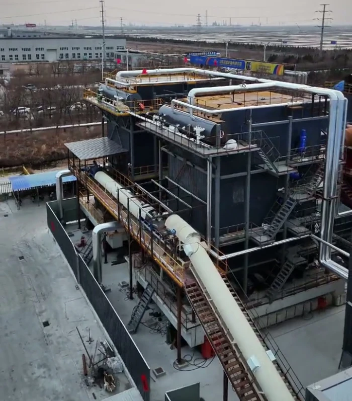 30-ton large-scale biomass boiler operating at full capacity, showcasing robust construction and high-efficiency performance for industrial heating and energy solutions